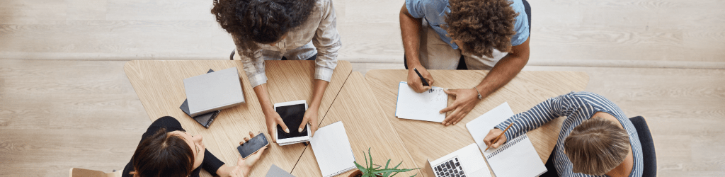 Portugal EOR team meeting - employment solutions specialists discussing compliant hiring and employer of record service