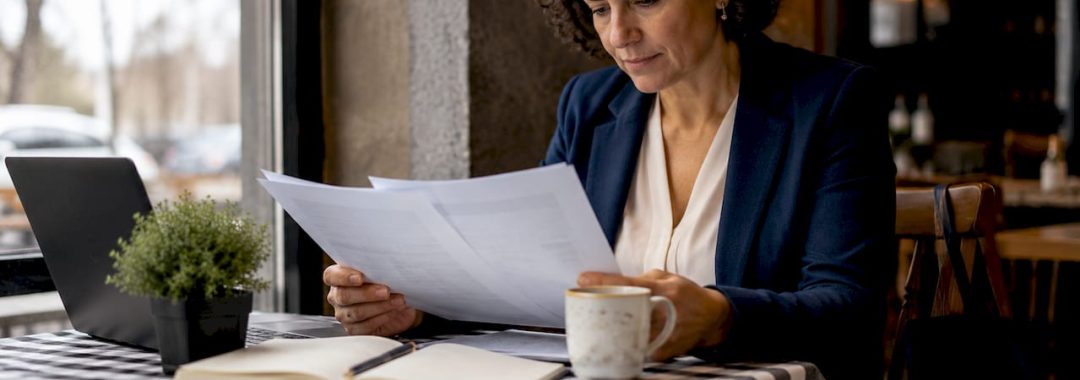 Business owner reviewing outsourcing documents
