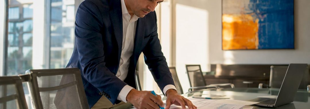 Finance manager reviewing labor cost documents