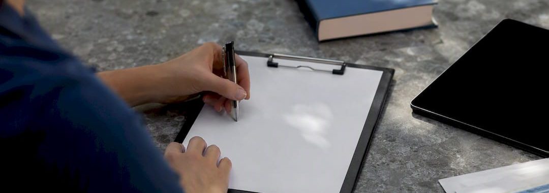 Hands registering employee with social security