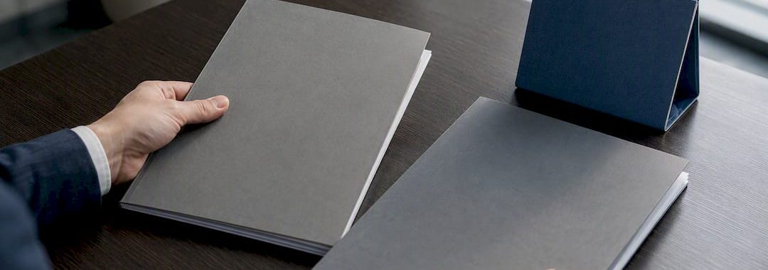 Employment contract folders beside calendar